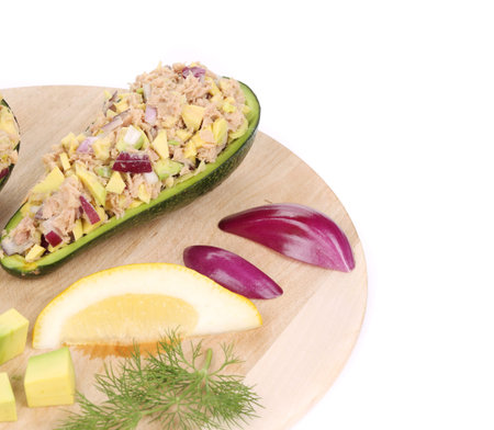 Avocado salad and tuna. Isolated on a white background.
