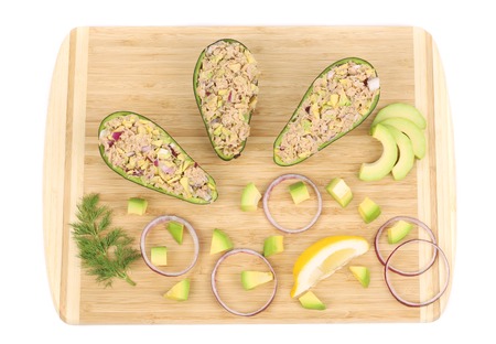 Avocado salad with tuna. Located on the wooden hardboard.の写真素材