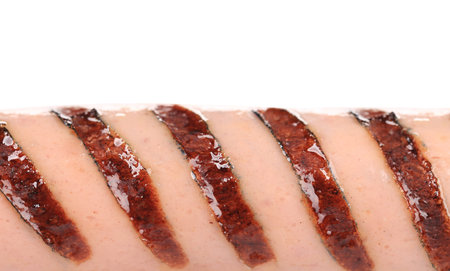 Grilled cut sausages close up. Whole background.