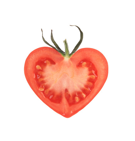 Heart-shaped tomato. Isolated on a white background.の写真素材