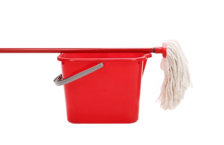 Red bucket with cleaning mop. Isolated on a white background.の写真素材