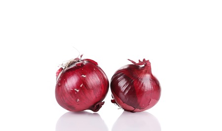 Red onions. Isolated on a white background.の写真素材