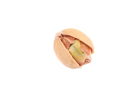 One salted pistachio. Isolated on a white background.の写真素材