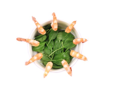Boiled shrimps and fresh spinach. の写真素材