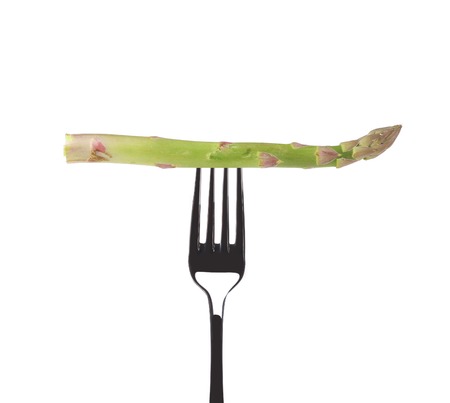 Green fresh asparagus on fork.の写真素材
