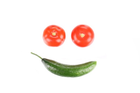 Crazy face from tomatoes and cucumber. の写真素材