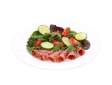 Salad with salami. Isolated on a white background.の写真素材