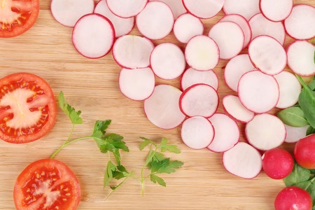 Radish cucumber and tomato on platter. の写真素材