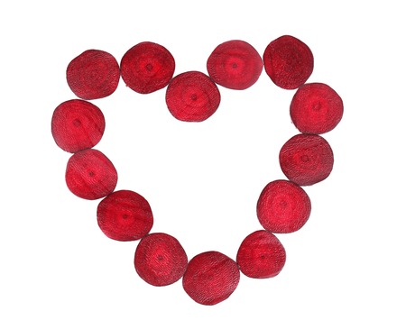Heart shaped of beetroot slices. Isolated on a white background.の写真素材