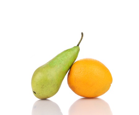 Tasty orange and pear. Isolated on a white background.の写真素材