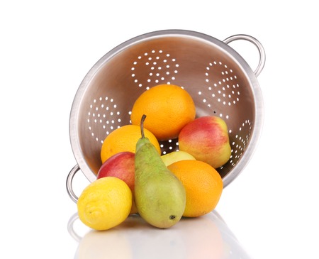 Metal colander full of juicy fruits. Isolated on a white background.の写真素材