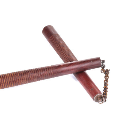 Weapon nunchaku closeup. Isolated on a white background.