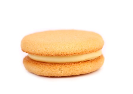 Biscuit sandwich with white filling. Close up. White background.の写真素材