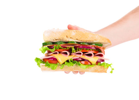 Hand holding fresh sandwich. Isolated on a white background.の写真素材