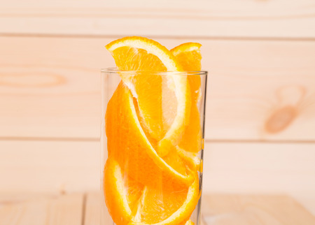 Close up of glass full of sliced orange.の写真素材