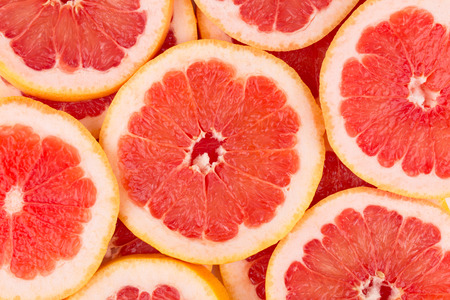 Close up of sliced grapefruit as a background.の写真素材
