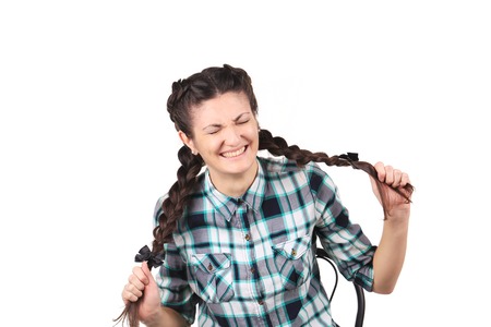 Beautiful emotional girl on a white background closeupの写真素材