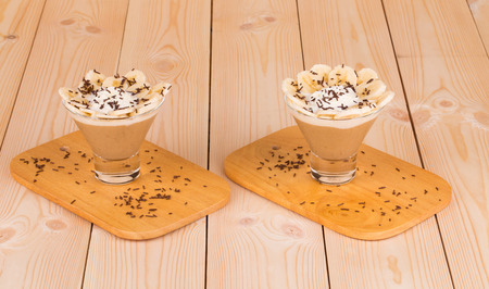 Fresh made Banana Milkshake on wooden background closeupの写真素材