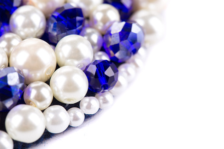 White pearl and blue strass. Half background is white.の写真素材