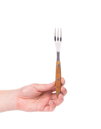 Man hand with fork isolated on white backgroundの写真素材