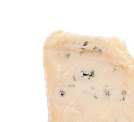 Close up of blue cheese. Isolated on a white background.の写真素材
