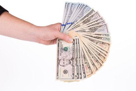 Male hand holding american Dollar-bills. Isolated on the white background.