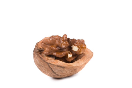 Cracked walnut. Isolated on a white background.