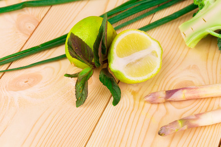Close up of various ripe vegetables on cutting board.の写真素材