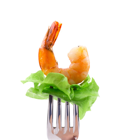 Shrimp on fork. Isolated on a white background.の写真素材