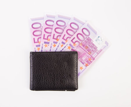 Wallet with five hundreds euro banknotes. Isolated on a white background