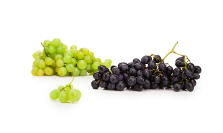 Black and green ripe grapes. Isolated on a white backgropund.の写真素材