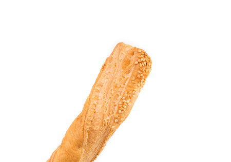 Cheese stick cracker with sesame seeds. Isolated on a white background.の写真素材
