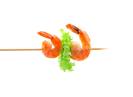 Grilled shrimps on a stick. Isolated on a white background.の写真素材