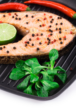 Fresh grilled salmon steak. Isolated on a white background.の写真素材