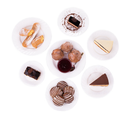 Sweets on a white plates on a white background in the closeupの写真素材