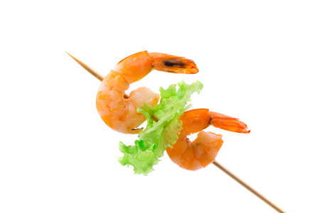 Grilled shrimps on a stick. Isolated on a white background.の写真素材