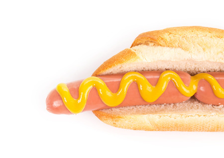 Tasty grilled hotdog with mustard. Isolated on a white background.の写真素材