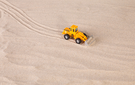 Yellow loader on the sand. Close up.の写真素材