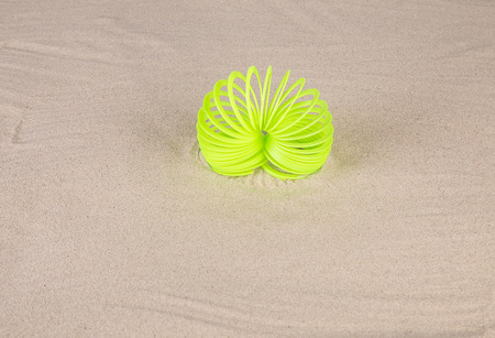 Bright yellow spring on sand. Close up.の写真素材