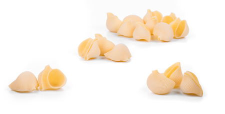 Close up of Italian pasta shells. Isolated on a white background.の写真素材