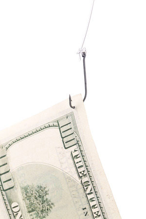 One hundred dollar bill on a hook. Isolated on a white background.の写真素材