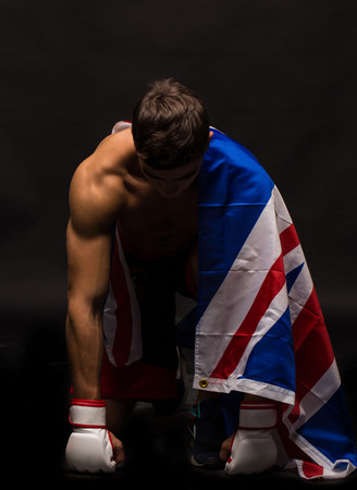 Male model. Kickboxing. Located on the back background.の写真素材