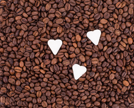 Coffee Beans with sweet hearts isolated on white background in the closeupの写真素材
