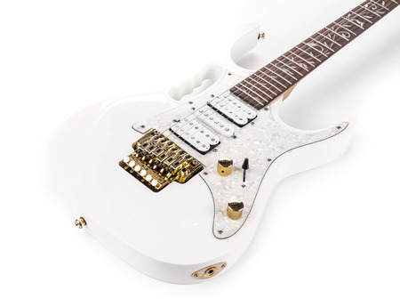 Beautiful white electric guitar isolated on a whiteの写真素材