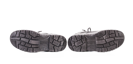 Black shoes soles. Isolated on a white background.の写真素材