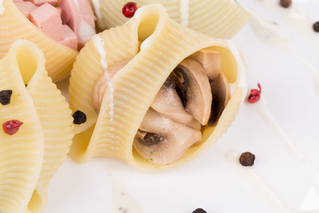 Pasta shells stuffed with vegetables and sausageの写真素材