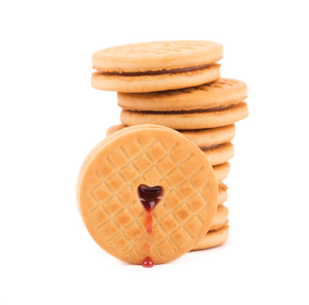 Stack of cookie biscuits with filling. Isolated on a white background.の写真素材