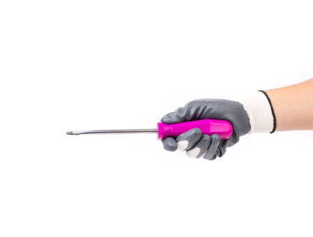 Hand holding a pink screwdriver. Isolated on a white background.の写真素材