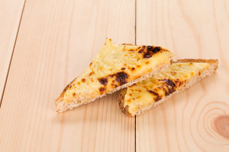 Grilled cheese sandwich. Close up on the wooden background.の写真素材