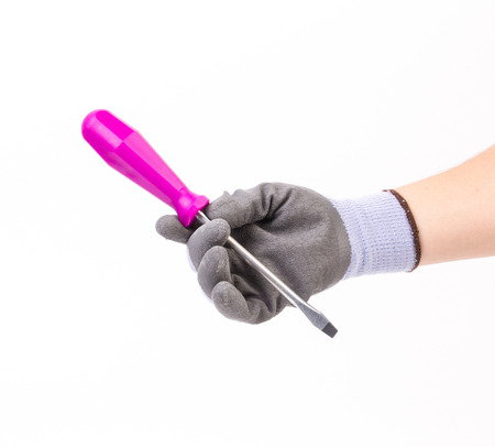 Hand with glove holding a screwdriver isolated on white backgroundの写真素材